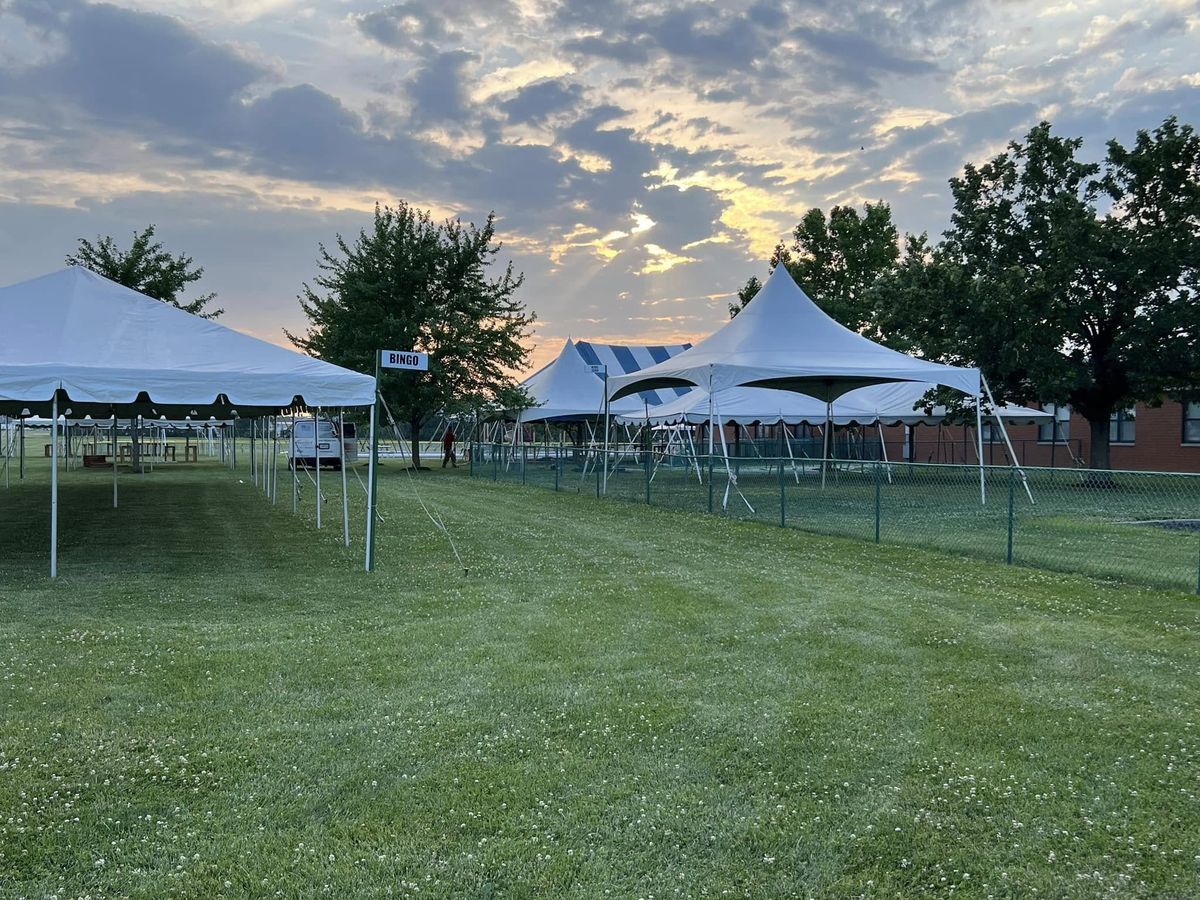 Festival tents with bingo sign at sunrise